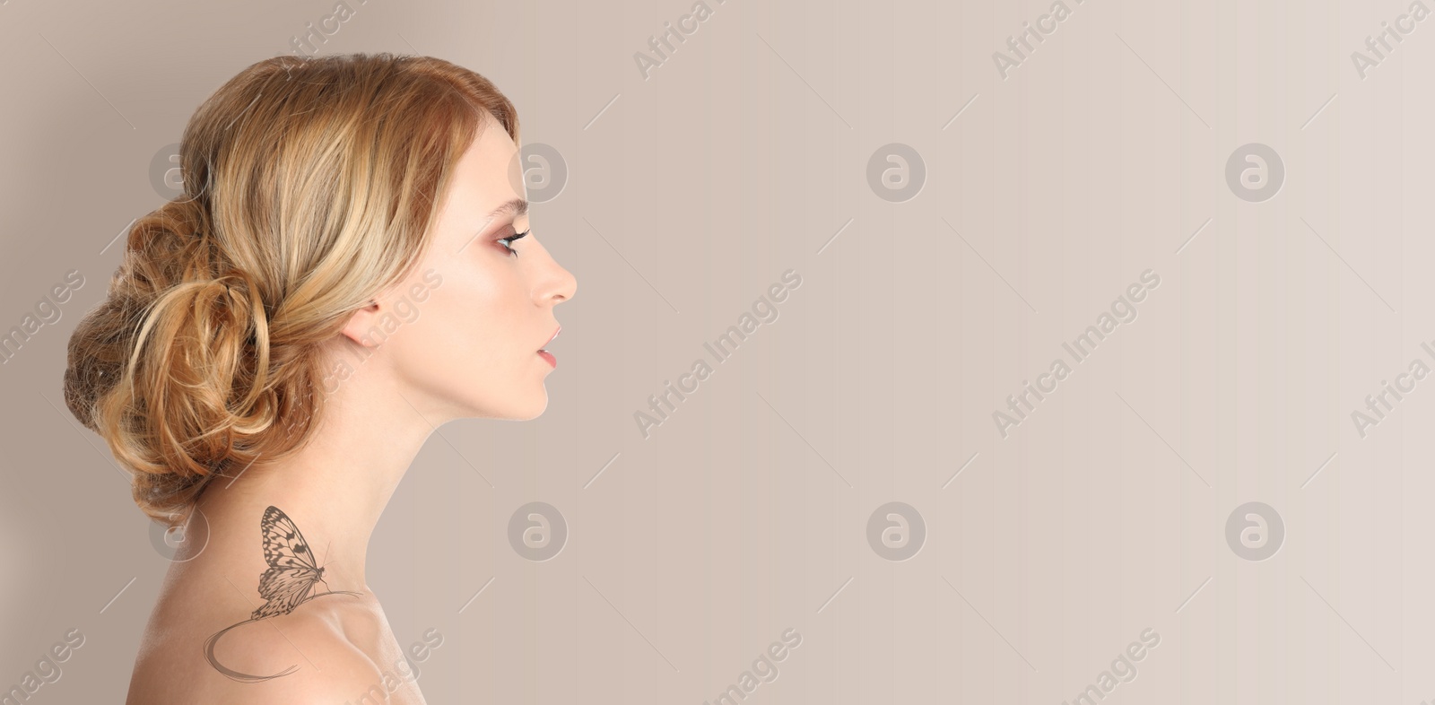 Image of Young woman with beautiful butterfly tattoo on beige background, side view. Banner design with space for text