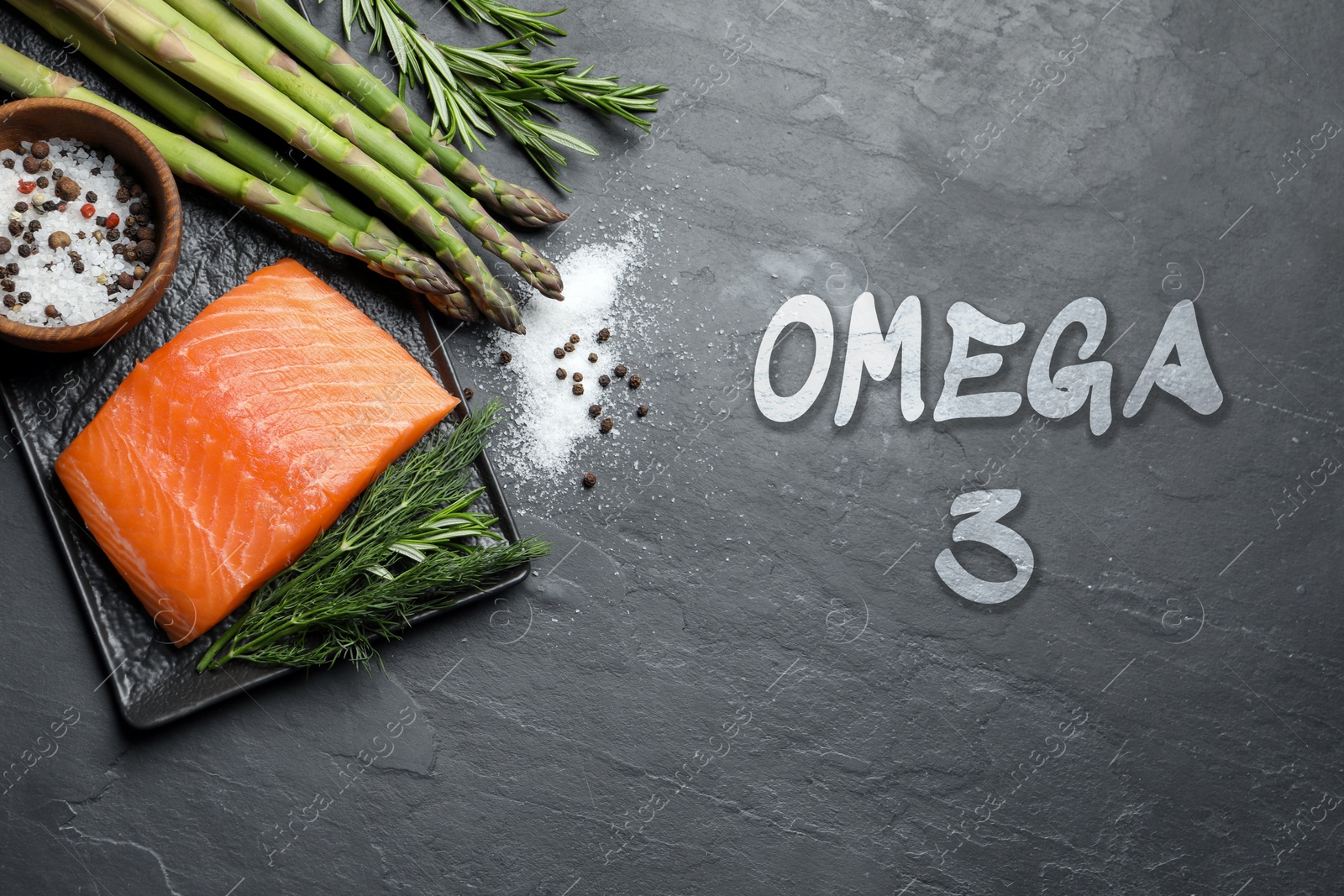 Image of Omega 3. Piece of fresh salmon, herbs and spices on dark table, flat lay