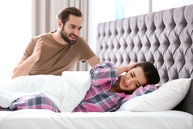 Young couple having argument in bedroom