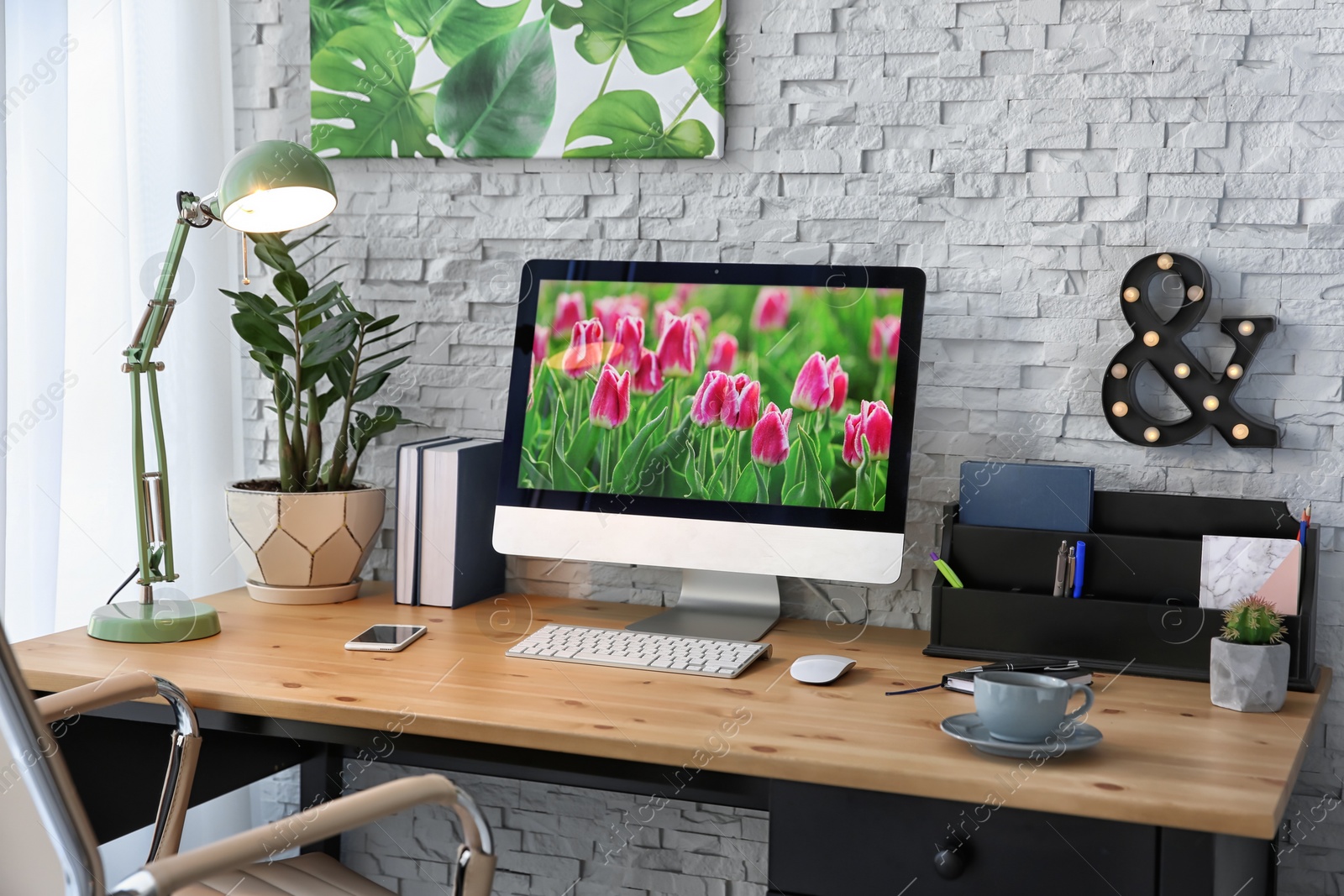 Photo of Stylish workplace with computer on table