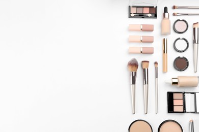 Photo of Flat lay composition with makeup brushes on white background, space for text