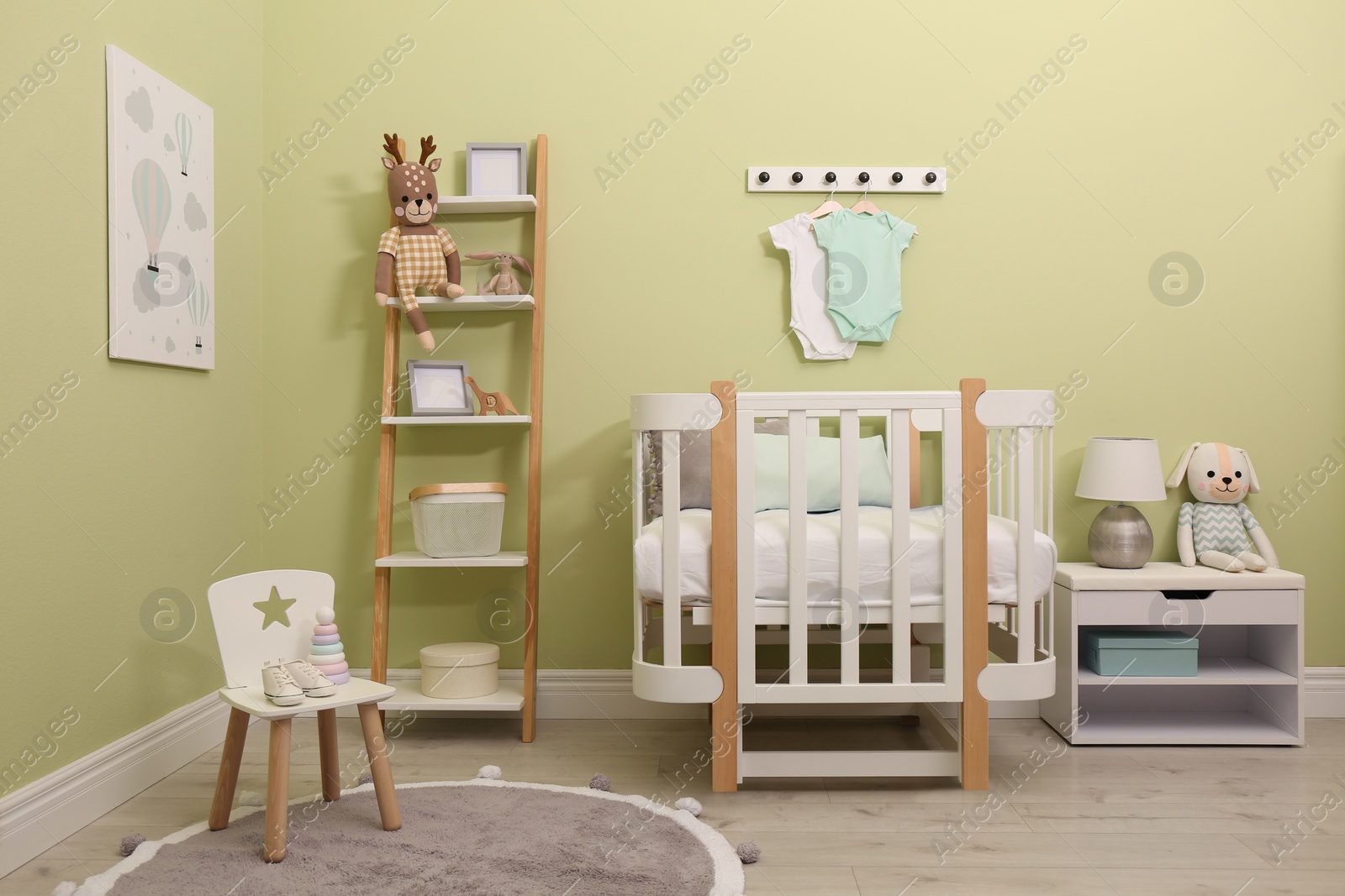 Photo of Baby room interior with stylish furniture and toys