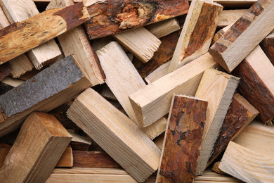 Photo of Cut firewood as background, top view. Heating in winter