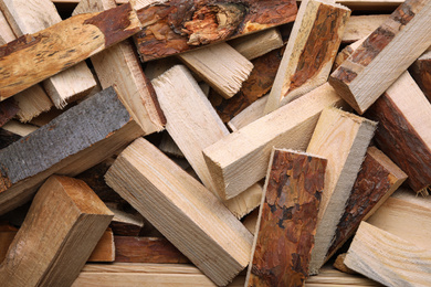 Cut firewood as background, top view. Heating in winter