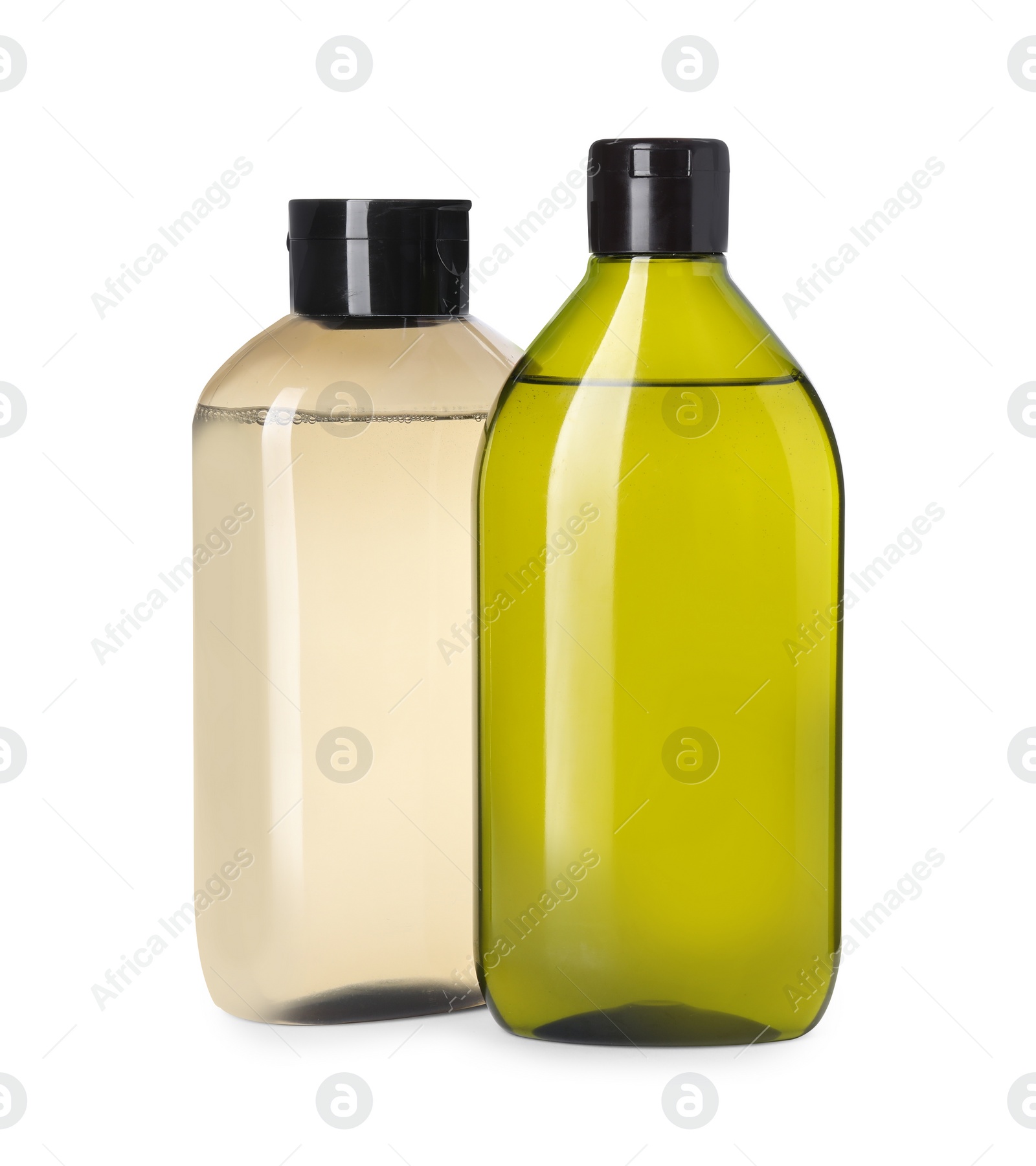 Photo of Different bottles of shampoo on white background