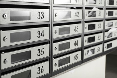 New mailboxes with keyholes, numbers and receipts in post office