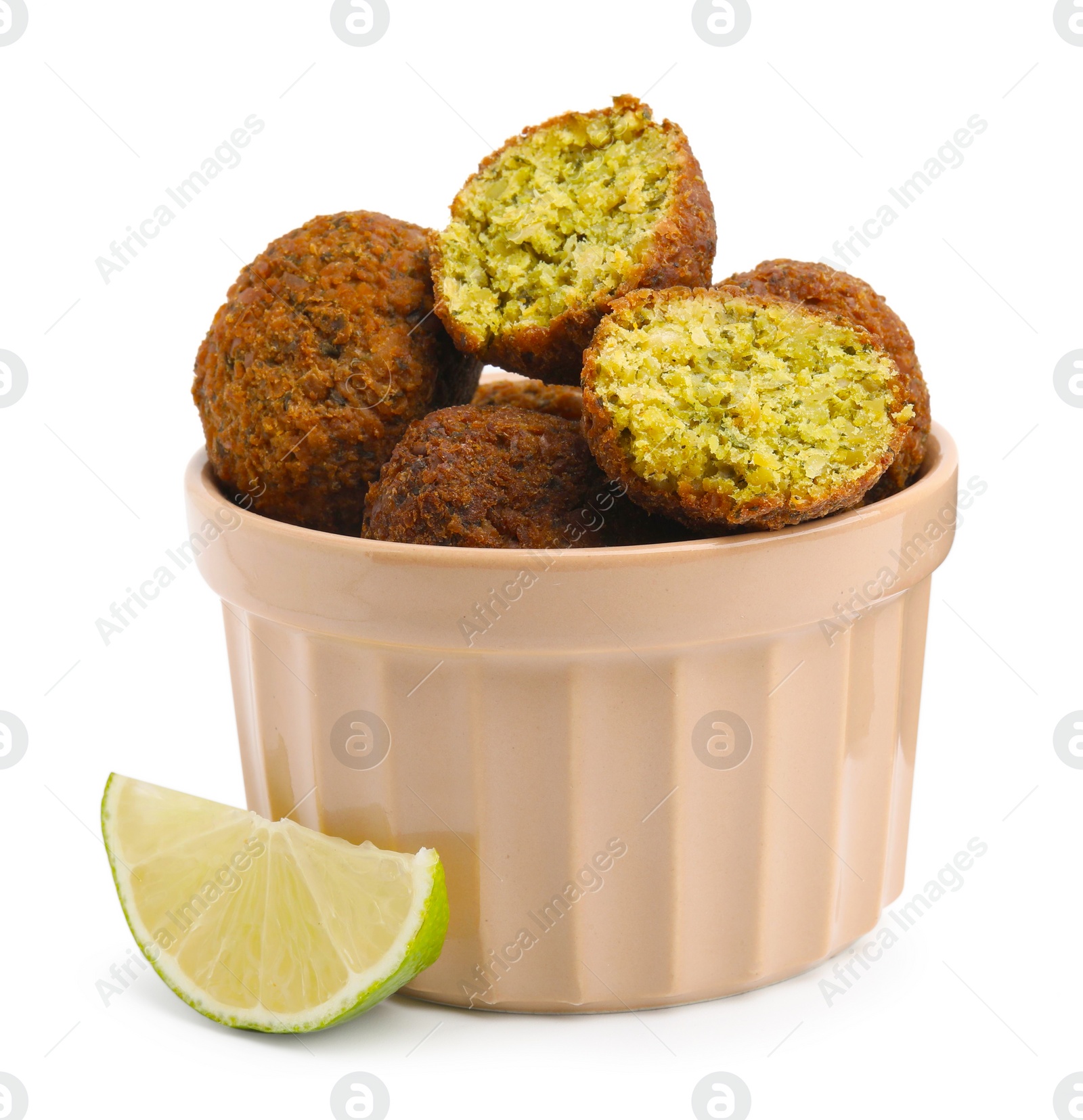 Photo of Delicious falafel balls in bowl and lime slice isolated on white