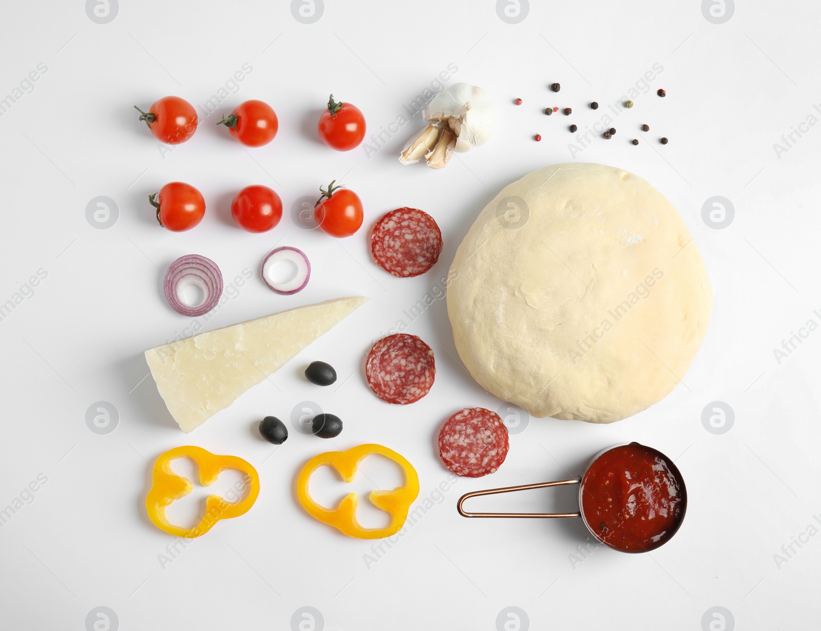 Photo of Flat lay composition with dough and ingredients for pizza on white background