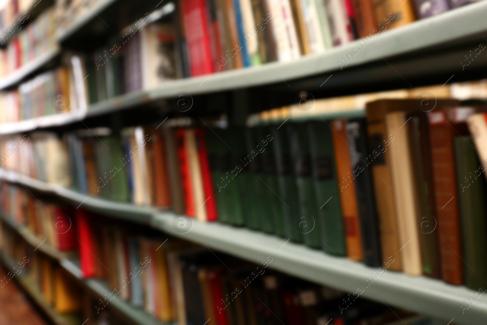 Photo of Blurred view of books on shelves in library