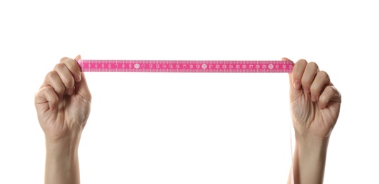 Woman holding pink measuring tape on white background, closeup
