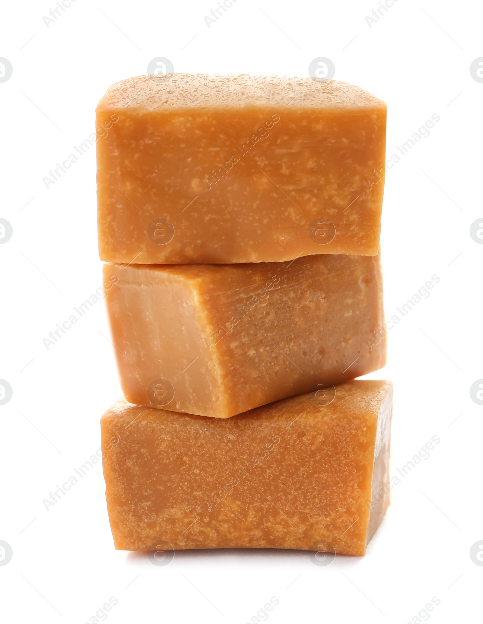 Photo of Delicious caramel candies on white background