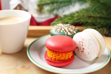 Photo of Different decorated Christmas macarons on table, closeup