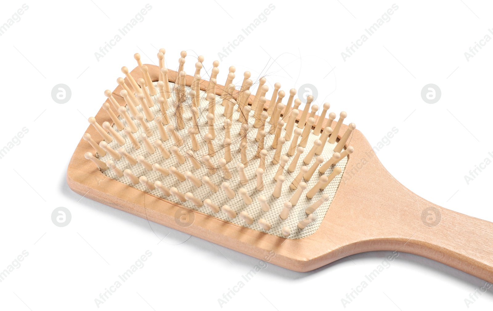 Photo of Wooden brush with lost hair isolated on white