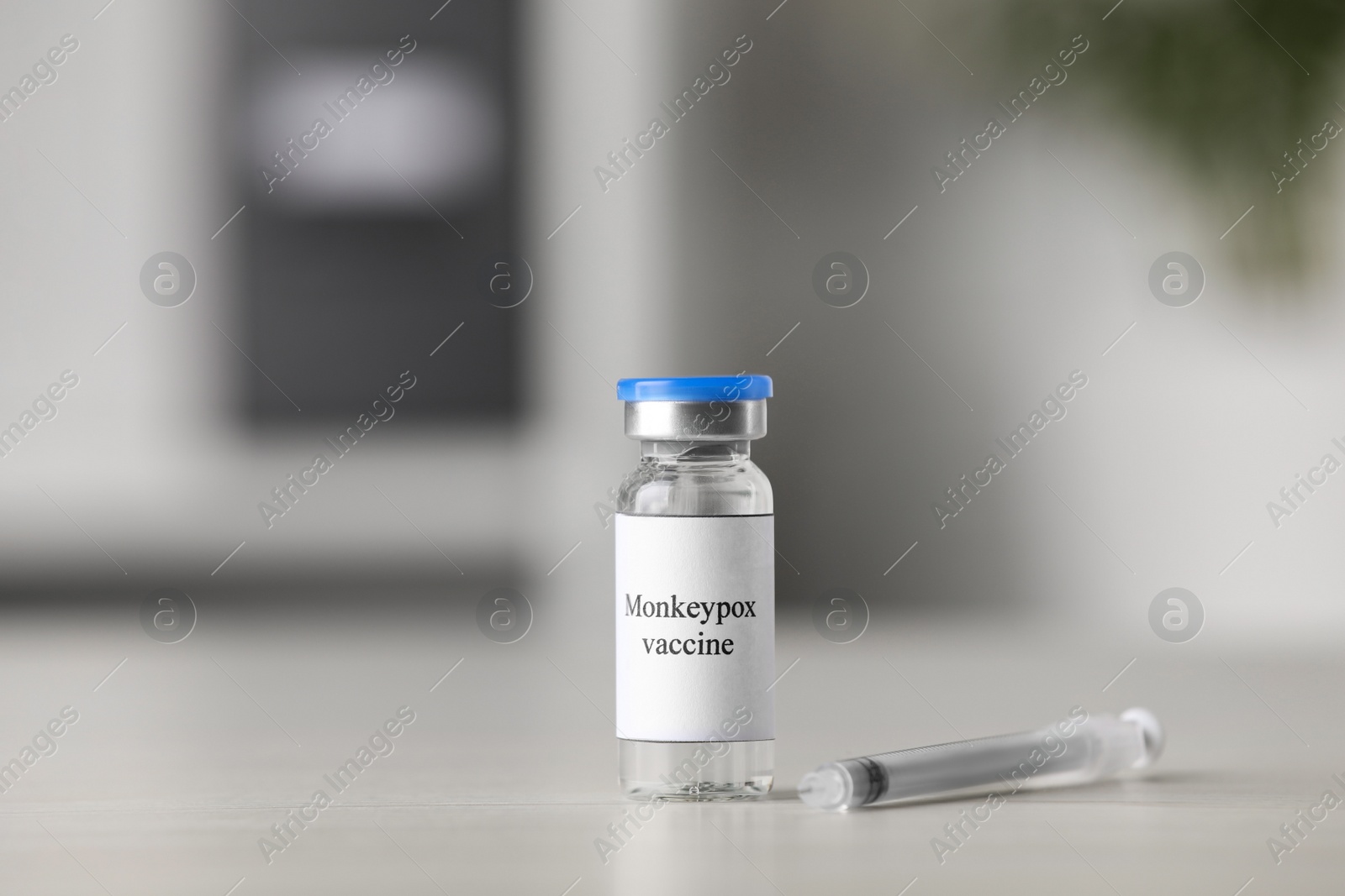 Photo of Monkeypox vaccine in vial and syringe on table