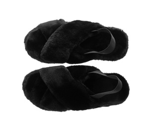Photo of Pair of soft slippers with black fur on white background, top view