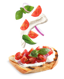 Image of Tasty bruschetta with flying ingredients on white background