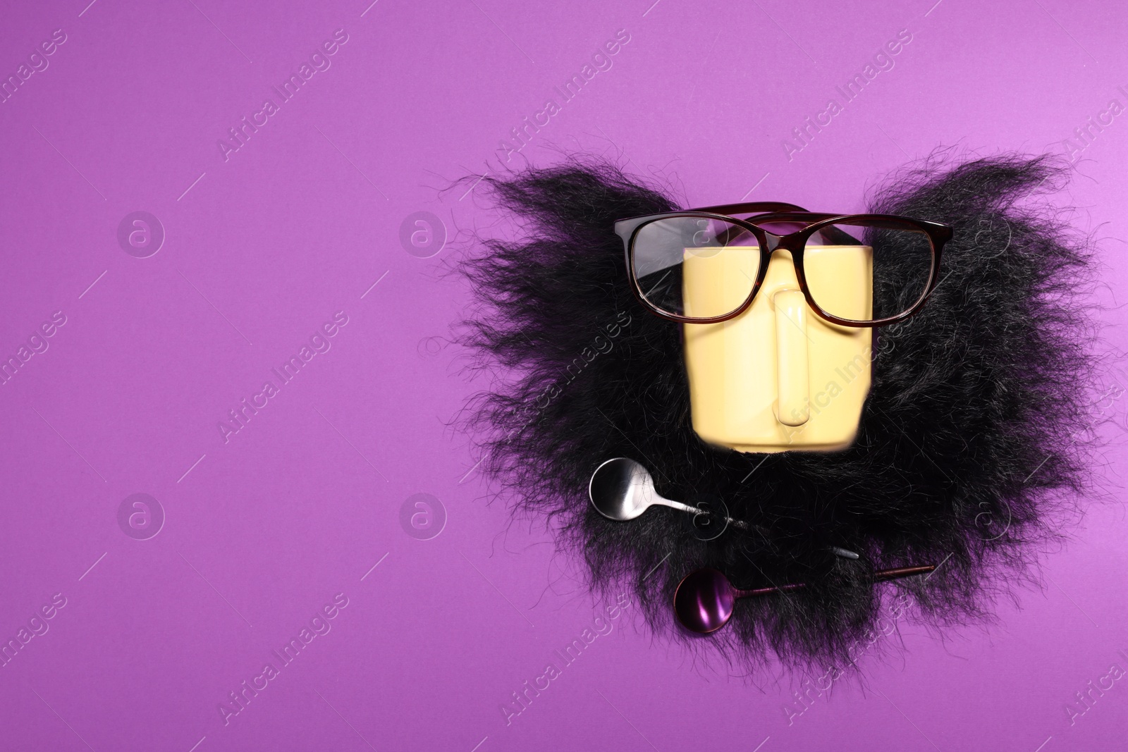 Photo of Man's face made of artificial beard, cup and glasses on purple background, top view. Space for text