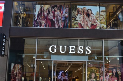 Photo of HAGUE, NETHERLANDS - SEPTEMBER 10, 2022: Entrance of GUESS store on city street