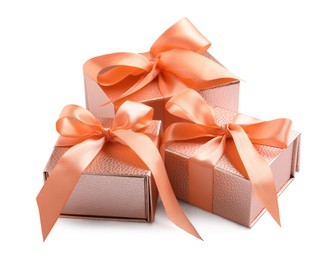 Photo of Gift boxes decorated with satin ribbon and bows on white background