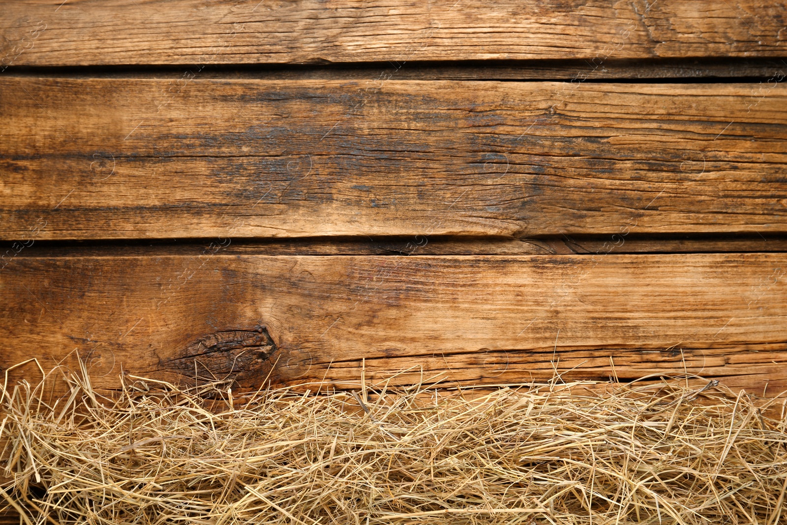 Photo of Dried hay on wooden background, flat lay. Space for text