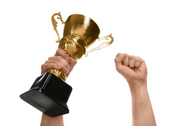 Young man holding gold trophy cup on white background, closeup