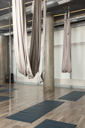 Photo of Many hammocks for fly yoga in studio