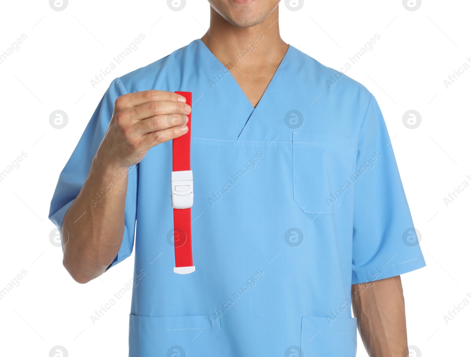 Photo of Male doctor holding tourniquet on white background, closeup. Medical object