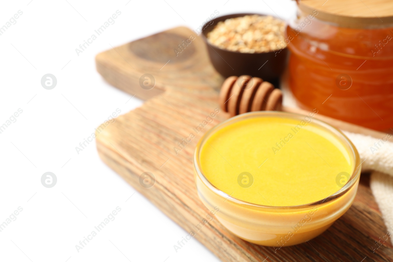 Photo of Handmade face mask and different ingredients on white background, closeup