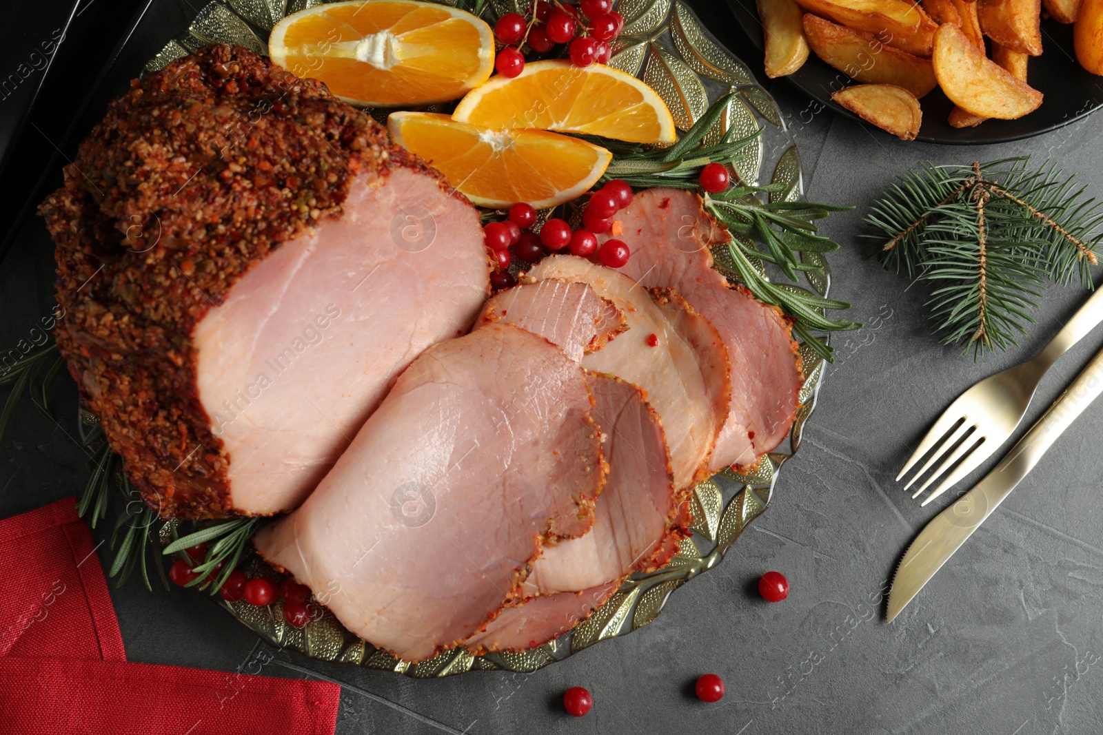 Photo of Flat lay composition with delicious ham for Christmas dinner on grey table