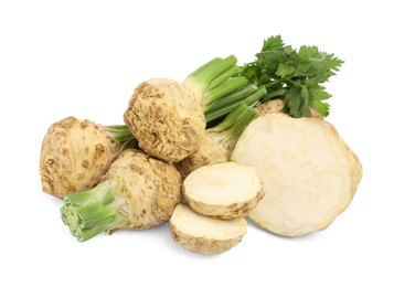 Whole and cut celery roots isolated on white