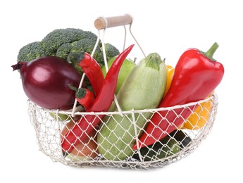 Photo of Fresh ripe vegetables and fruit in basket on white background