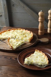 Tasty leek pie served on wooden table