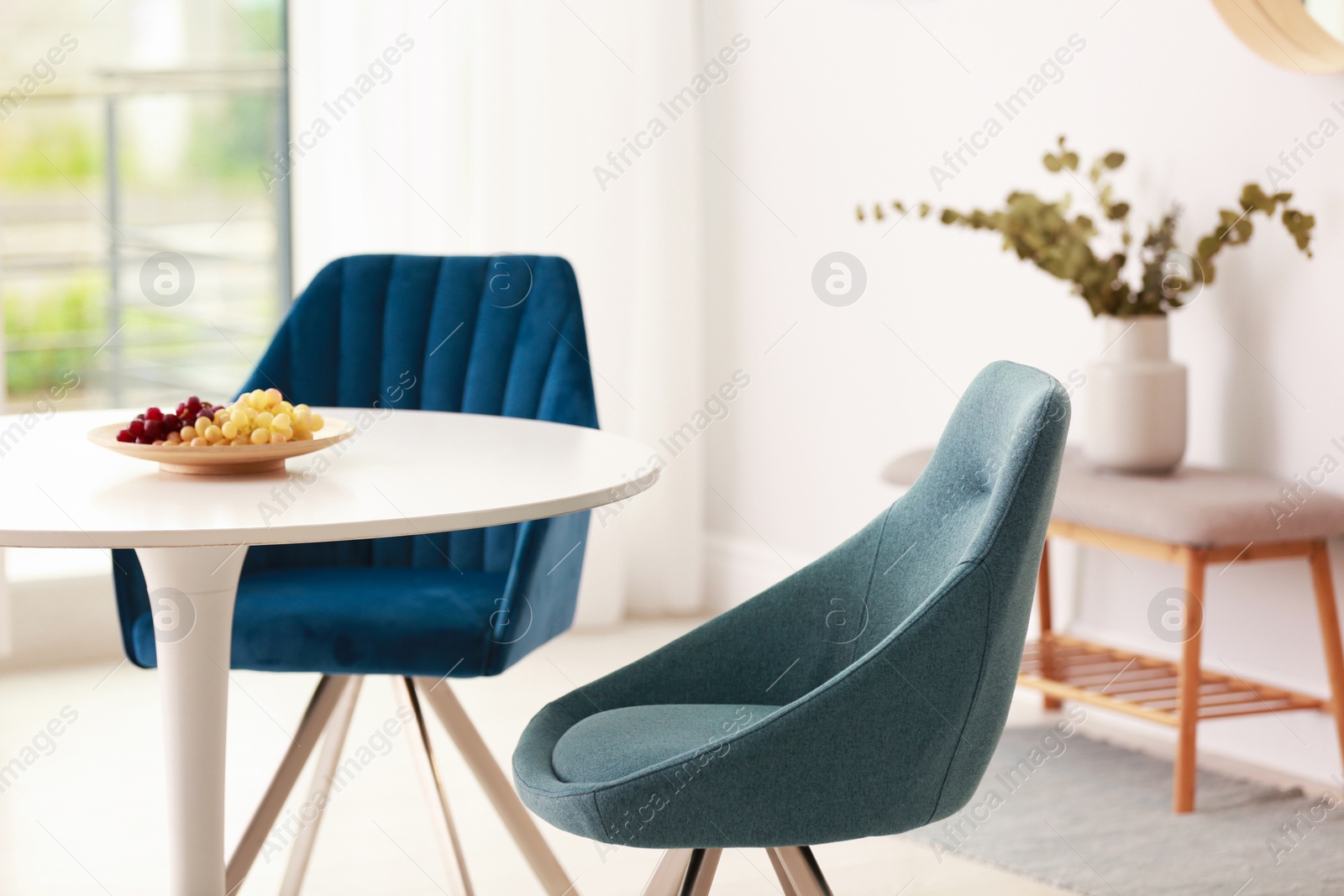 Photo of Modern dining room interior with table and chairs