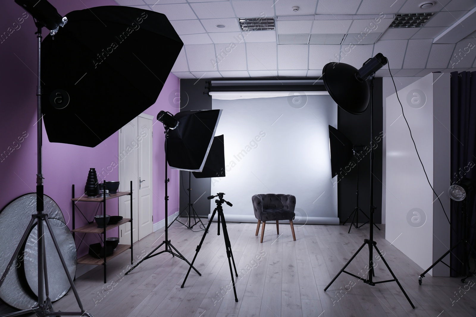 Photo of Interior of modern photo studio with professional equipment