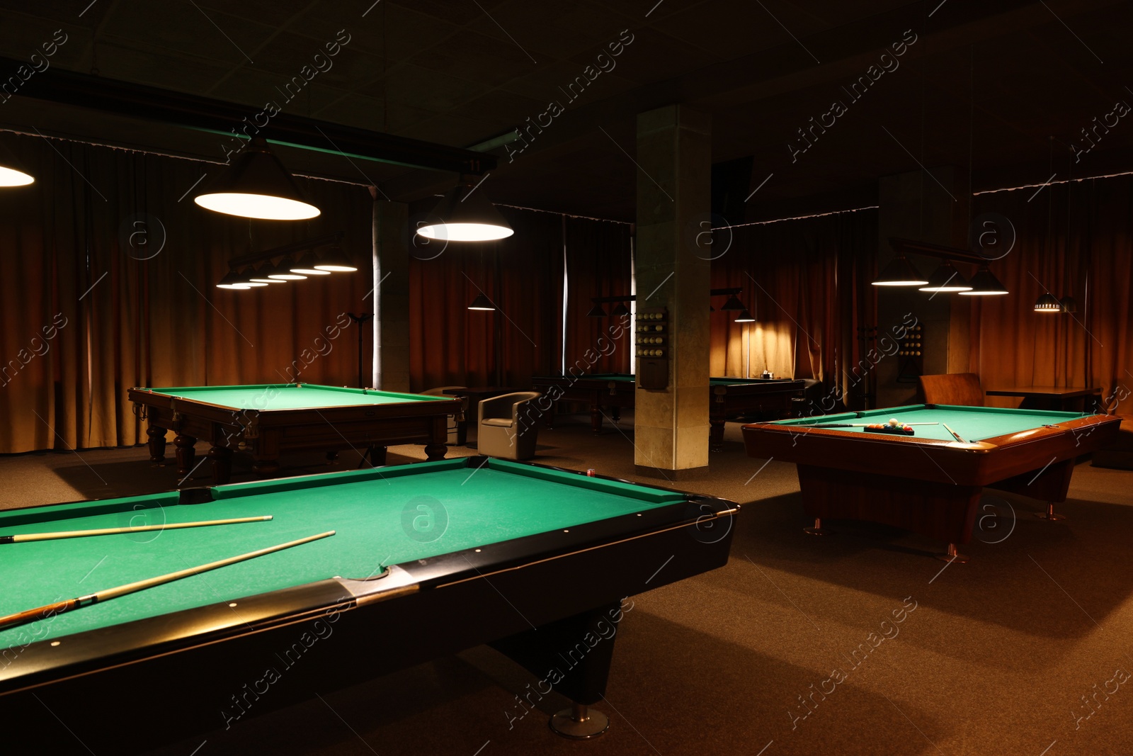 Photo of Empty green billiard tables in club. Pool Game