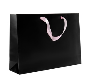 Photo of Paper shopping bag isolated on white. Mock up for design