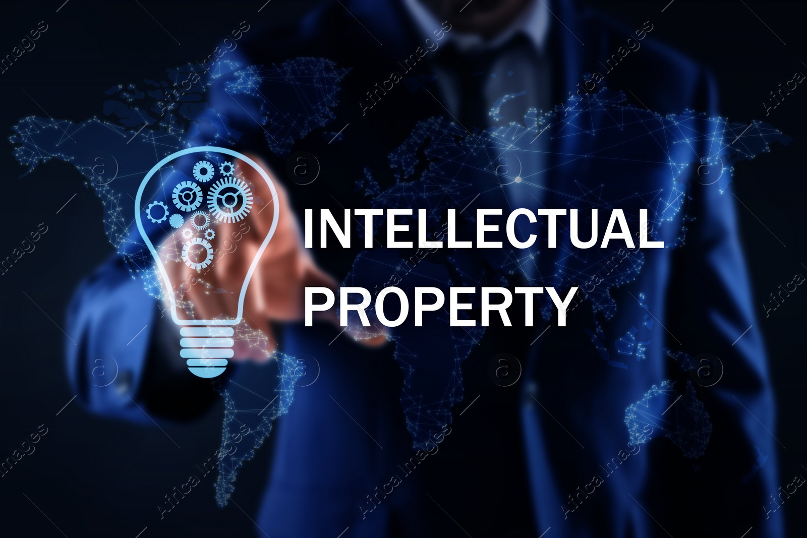 Image of Intellectual property concept. Man using virtual screen with world map and lamp bulb illustrations, closeup