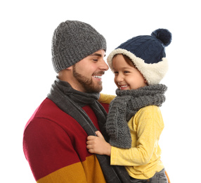 Photo of Happy father and son in warm clothes on white background. Winter vacation