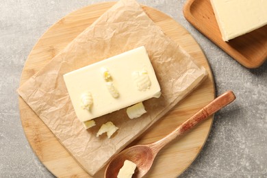 Tasty butter on grey table, top view