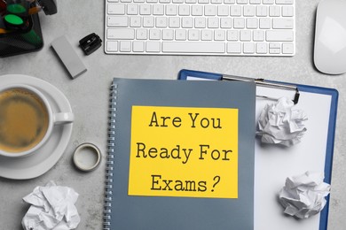 Photo of Sheet of paper with question Are You Ready For Exams? on grey table, flat lay