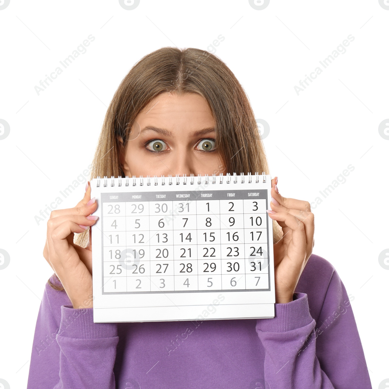 Photo of Young woman holding calendar with marked menstrual cycle days on white background