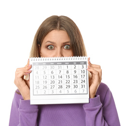 Photo of Young woman holding calendar with marked menstrual cycle days on white background