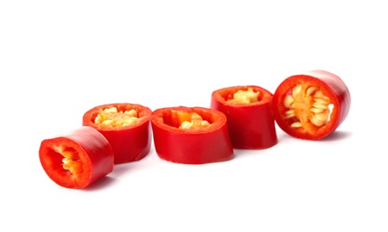Photo of Slices of red chili pepper on white background