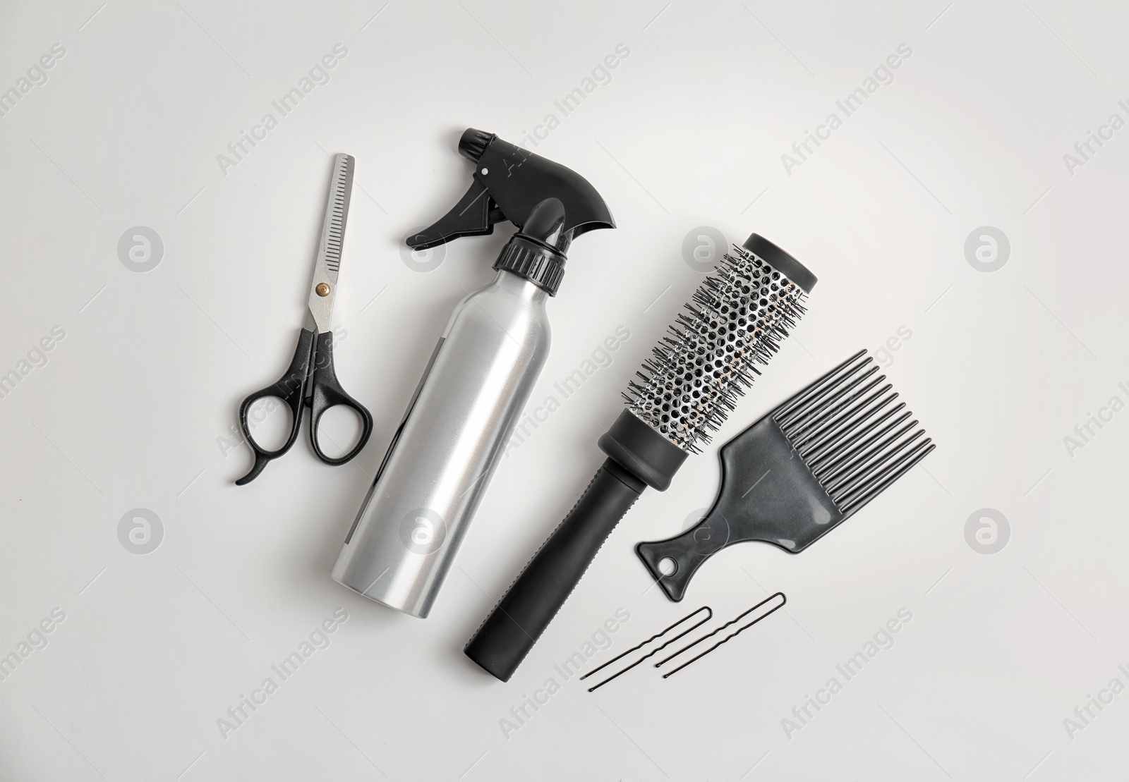 Photo of Professional hairdresser tools on white background