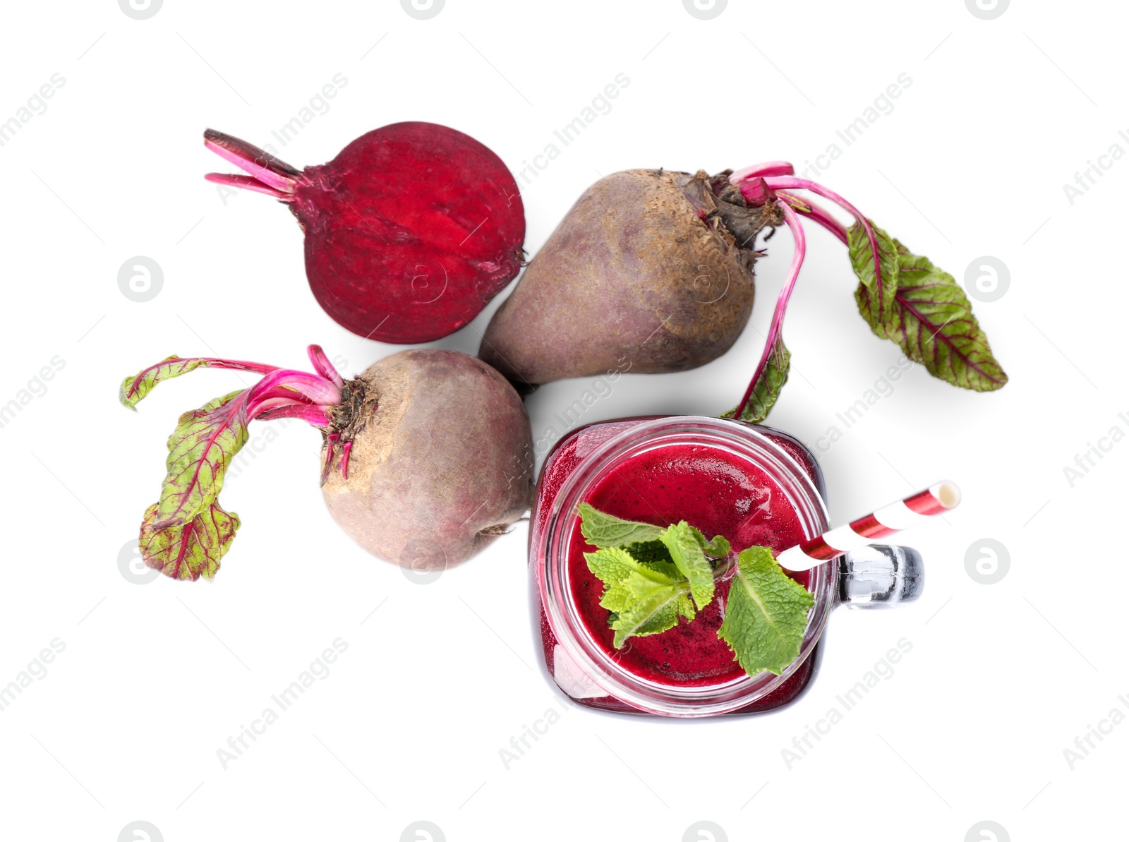 Photo of Fresh beets and juice isolated on white, top view