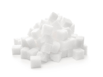 Photo of Heap of refined sugar cubes on white background