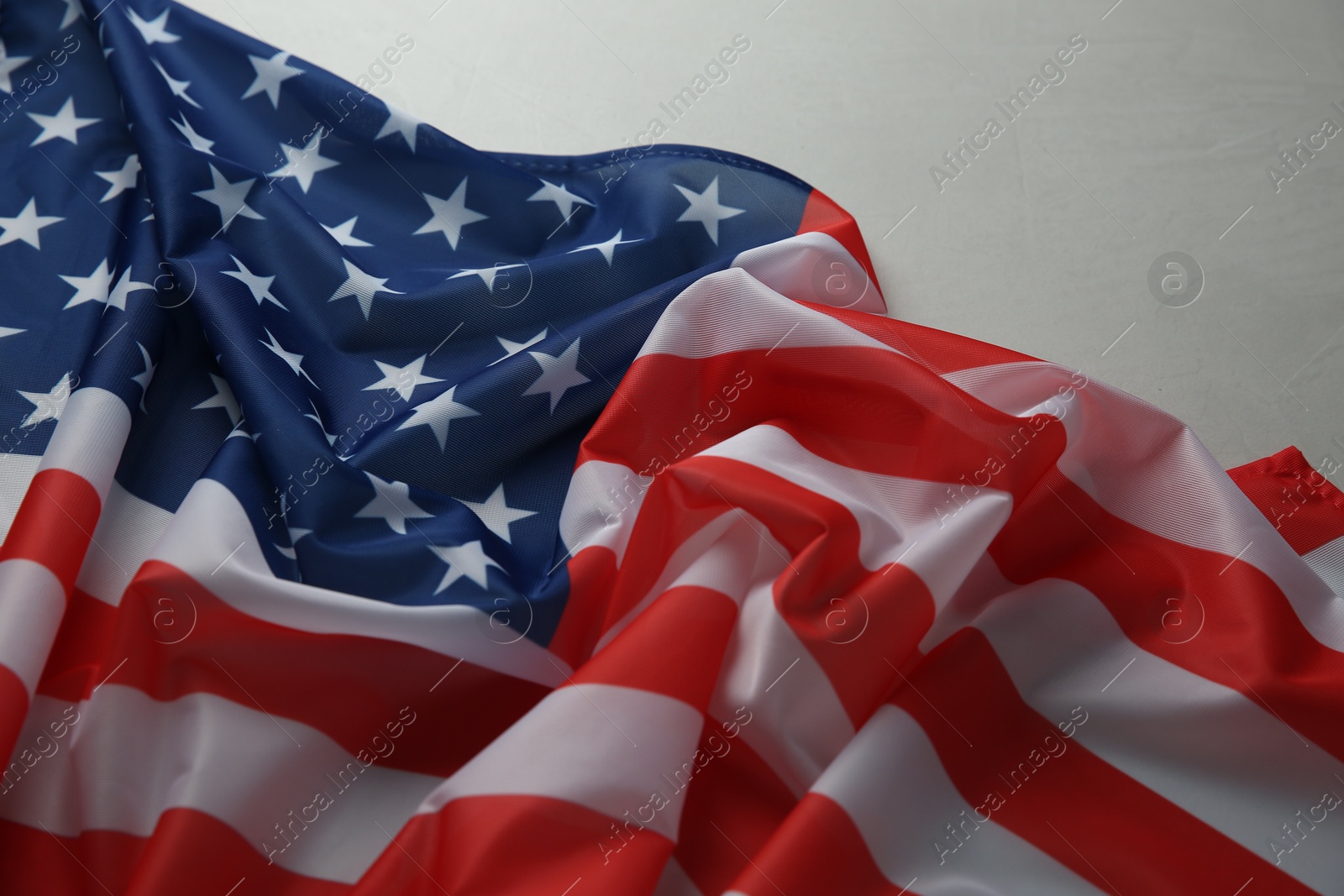 Photo of Flag of USA on white table, closeup