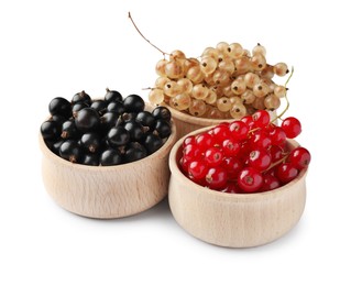 Photo of Fresh red, white and black currants in bowls isolated on white