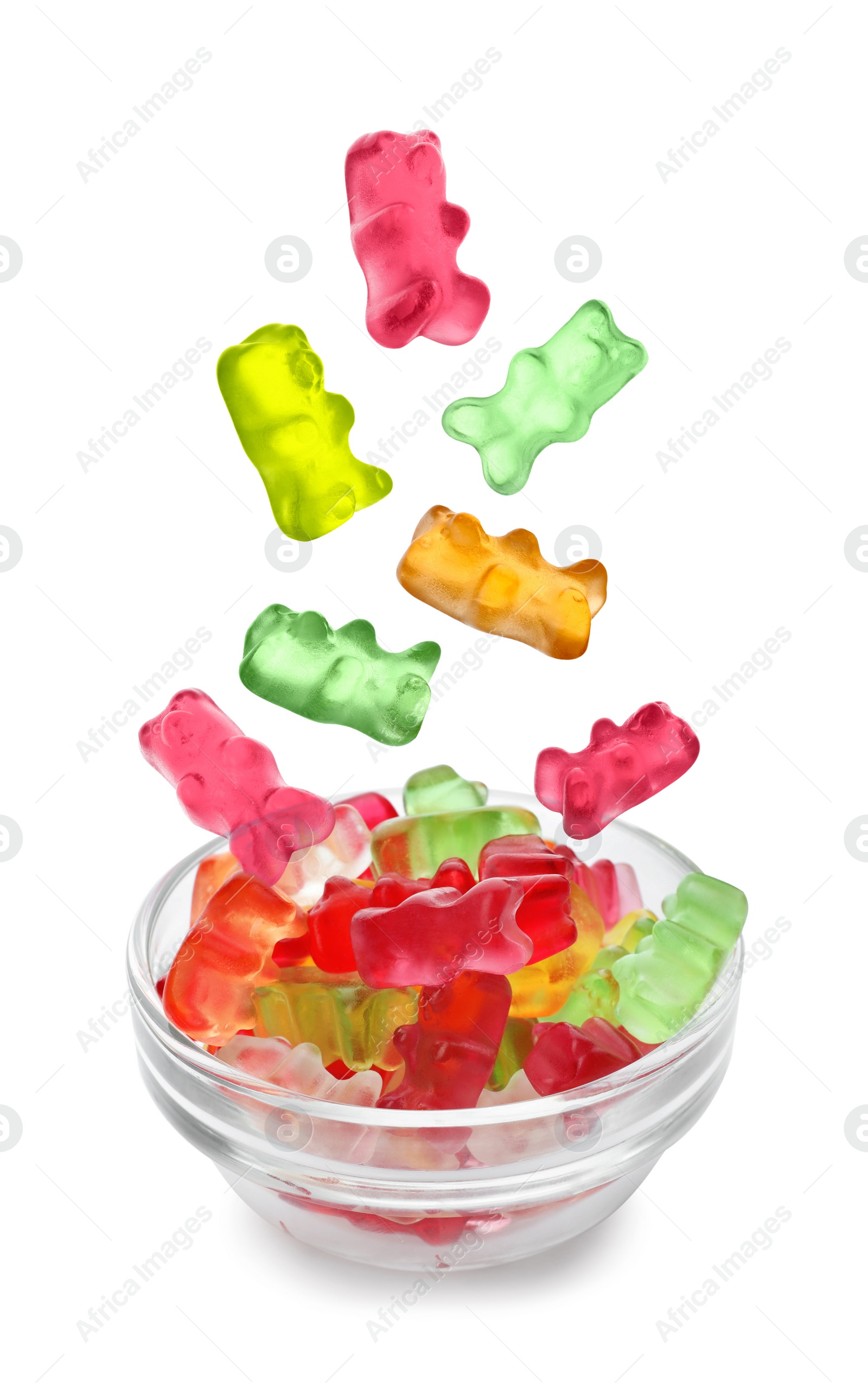 Image of Delicious jelly bears falling into bowl on white background