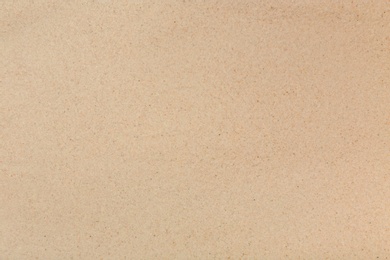 Photo of Dry beach sand as background, top view